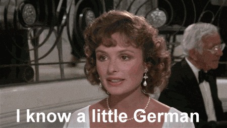 Игра слов.По-английски «I know a little German» можно перевести как «Я немного знаю немецкий» и «Я знаю маленького немца» - Он сидит вон там