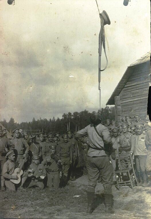 A Russian soldier demonstrates his ability to hold a Mosin rifle with a fixed bayonet on his chin. - World War I, The soldiers