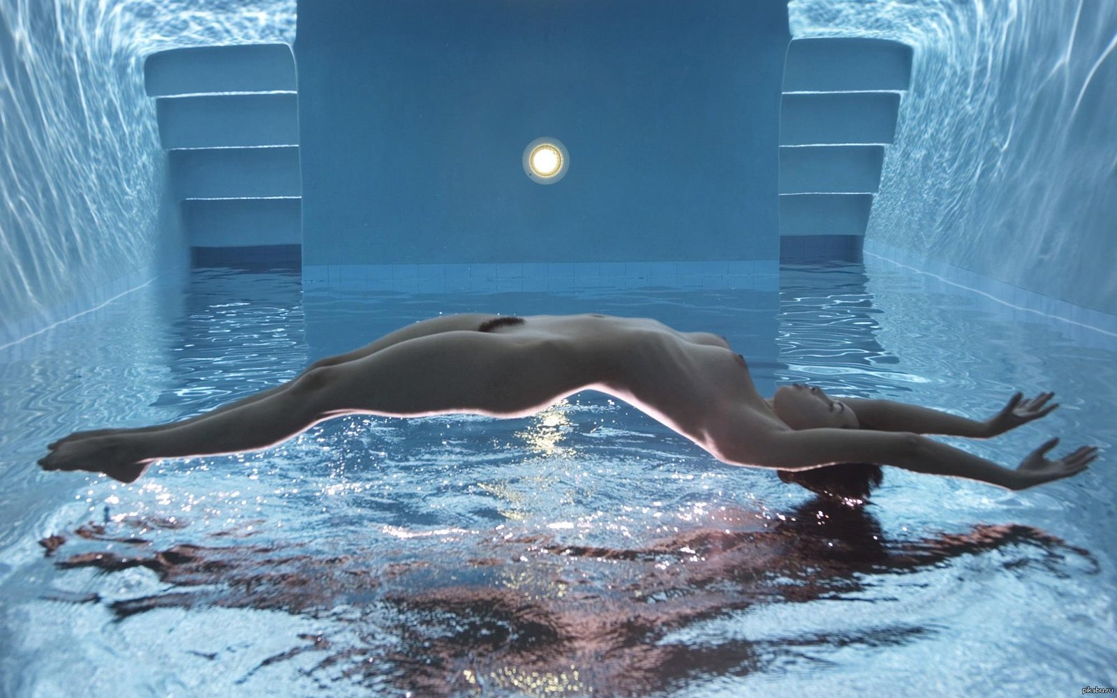 Naked swimming woman